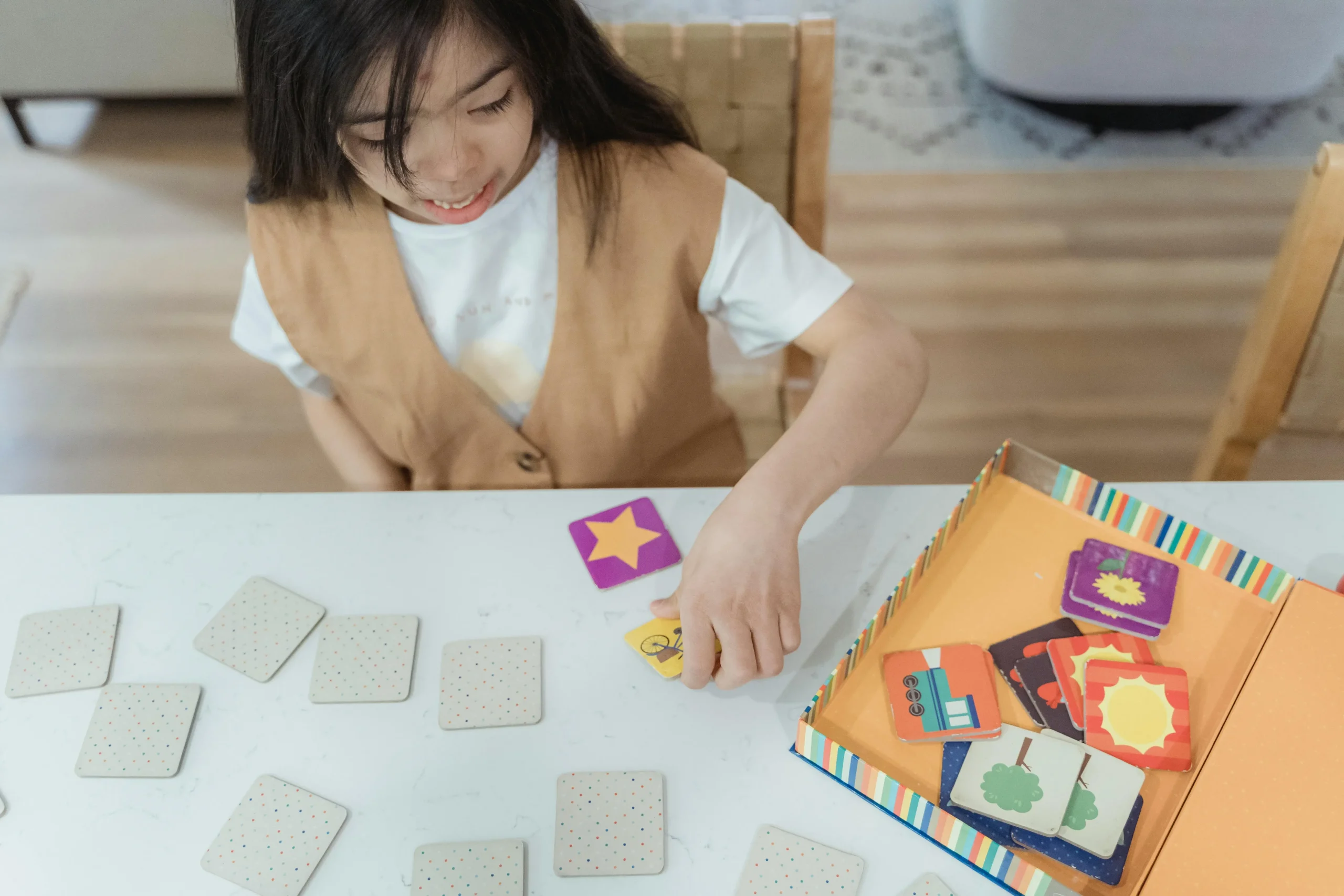 10 Fun Learning Activities for Toddlers That Boost Brain Development 10 toddler playing with cards