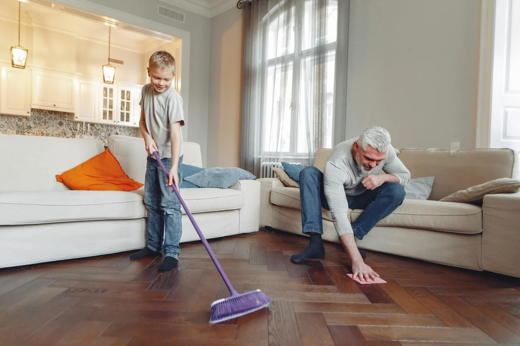 15 Genius Mom Tips for Keeping the House Clean With Kids Around 9 family cleaning the floor