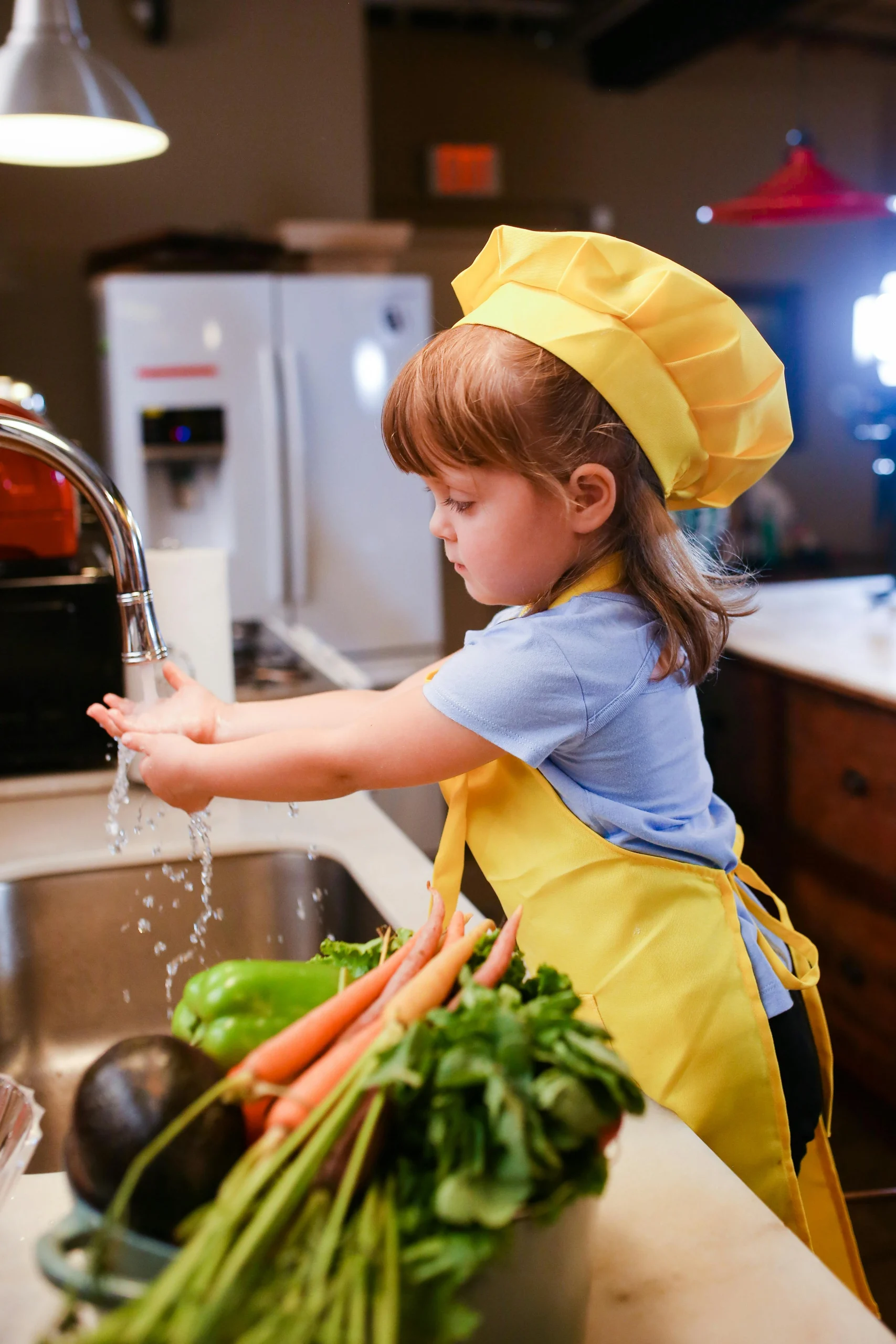 Fun Ways to Get Toddlers Eating Vegetables (Without the Mealtime Battles!) 5 kid washing vaggies