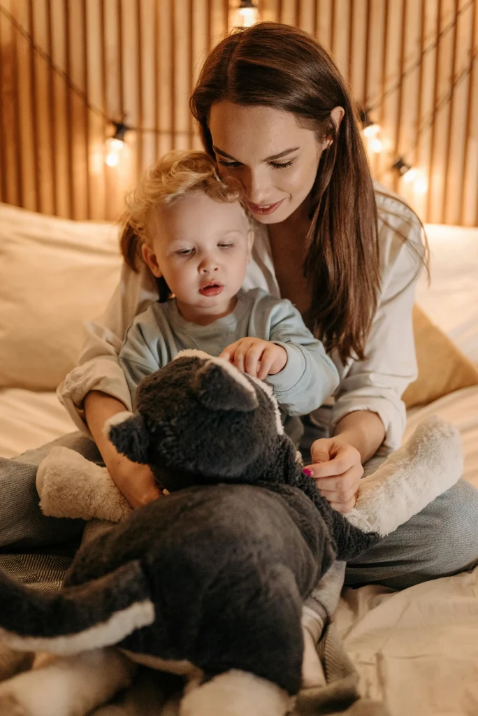 10 Calm-Down Tricks for Tantrums Every Toddler Mom Should Know 5 making toddler calm down with a toy