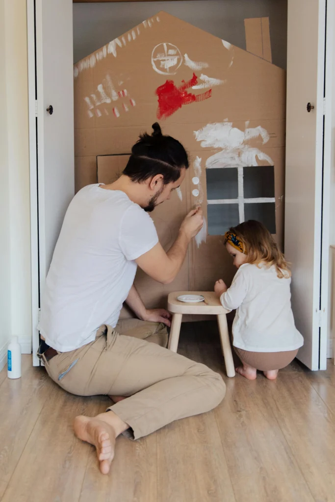40 Fun Activities for Toddlers to Boost Learning & Play 13 sponge painting father and daughter
