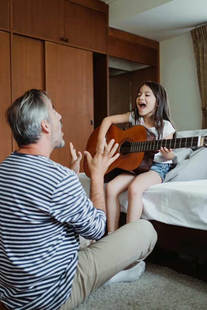 10 Fun Learning Activities for Toddlers That Boost Brain Development 12 father and girl singing rhymes
