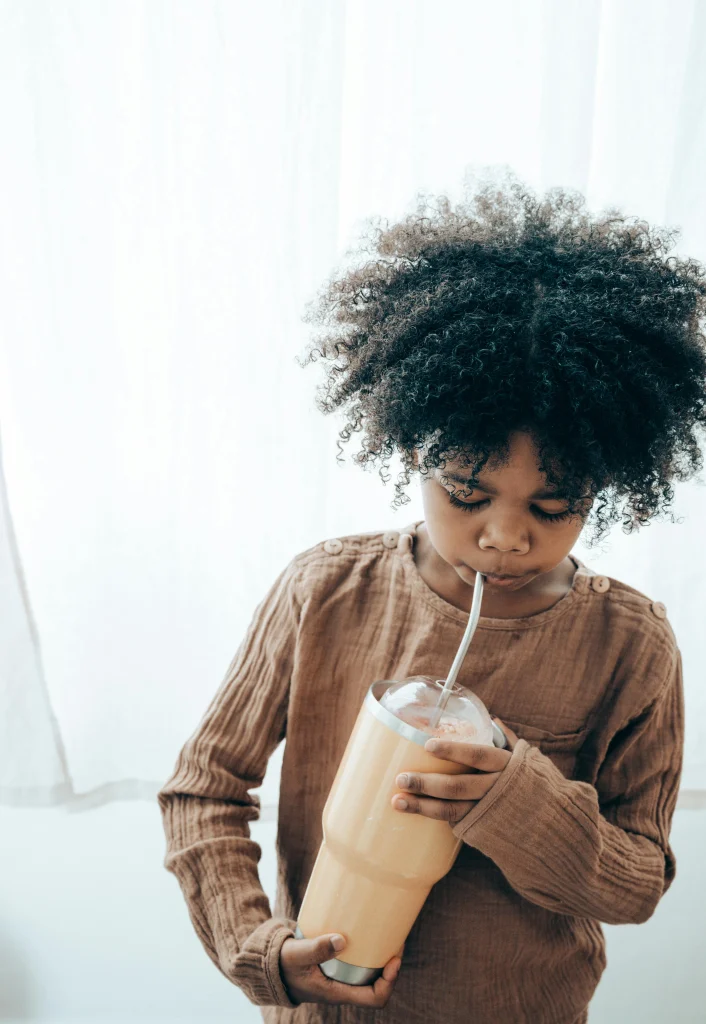 Fun Ways to Get Toddlers Eating Vegetables (Without the Mealtime Battles!) 7 toddler having smoothies