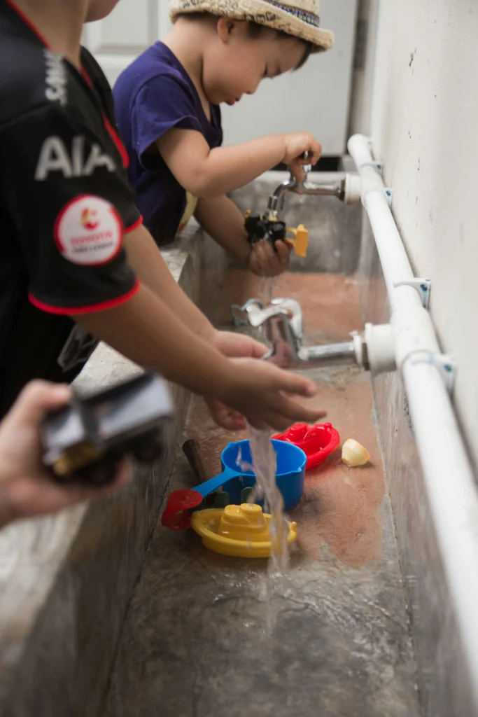 Sensory Play Ideas to Boost Toddler Development 7 kids water tap fun