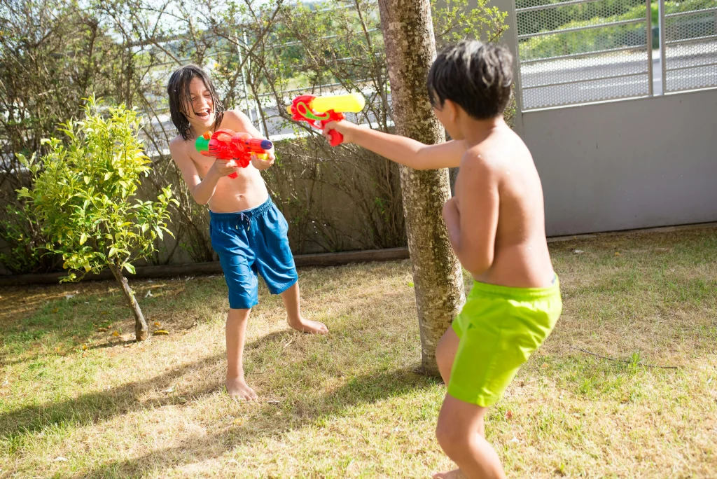 đź’¦26 Water Play Activities to Keep Kids Cool All Summer 20 water tag with squirting gun